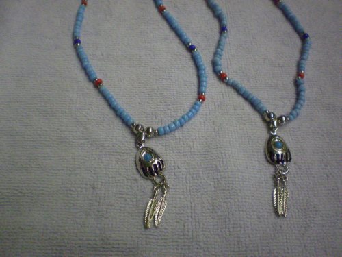 Bear paw & feather style necklace with silvertone,